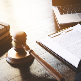 lawyer or judge business man working with paperwork agreement contract and gavel in Courtroom, Justice and Law firm Notary public concept.