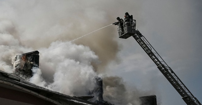 Firefighters work at the site of a building hit by a Russian drone strike, amid Russia's attack on Ukraine, in Zaporizhzhia, Ukraine, April 13, 2026. REUTERS/Stringer REUTERS