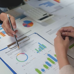 Team work process Team of business people searching for piles of papers and having a meeting Discuss business statistics, profits, financial growth rates in graph papers. financial data chart. crizzystudio - stock.adobe.com