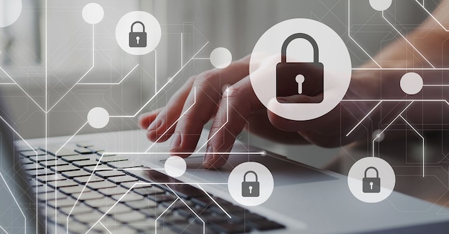 Cyber internet security concept. GDPR and cybersecurity. Protection of private personal data. A person using internet on laptop on the background. Michael Traitov  - stock.adobe.com