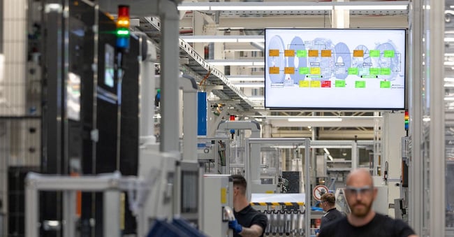 FILE PHOTO: Worker assemble axial-flux motors for electric vehicles on an assembly line at the Mercedes-Benz engine factory in Berlin, Germany June 9, 2026. REUTERS/Axel Schmidt/File Photo REUTERS