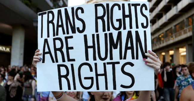 A member of the LGBTQ+ community holds a placard during the LGBTQ+ Pride parade in Athens, Greece, June 13, 2026. REUTERS/Louiza Vradi REUTERS