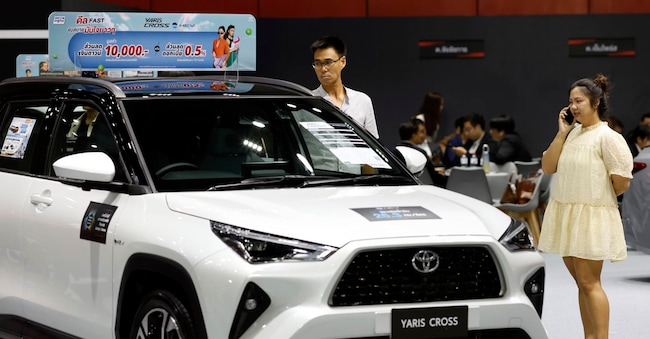 epa13077381 Potential customers inspect a Toyota Yaris Cross car at the Fast Auto Show Thailand 2026 in Bangkok, Thailand, 01 July 2026. The annual automotive sales event showcases new and used cars from leading automakers to meet consumer demand and boost Thailand's automotive sales. EPA/RUNGROJ YONGRIT EPA