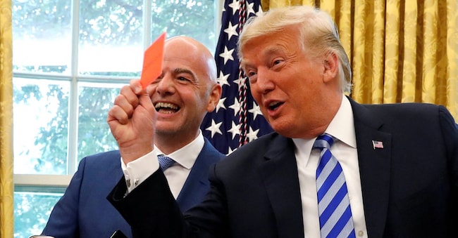 FILE PHOTO: U.S. President Donald Trump holds up a red card as he meets with FIFA President Gianni Infantino in the Oval Office of the White House in Washington, U.S., August 28, 2018. REUTERS/Leah Millis/File Photo REUTERS