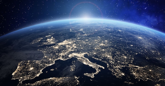 Planet Earth viewed from space with city lights in Europe. World with sunrise. Conceptual image for global business or European communication technology, elements from NASA NicoElNino - stock.adobe.com