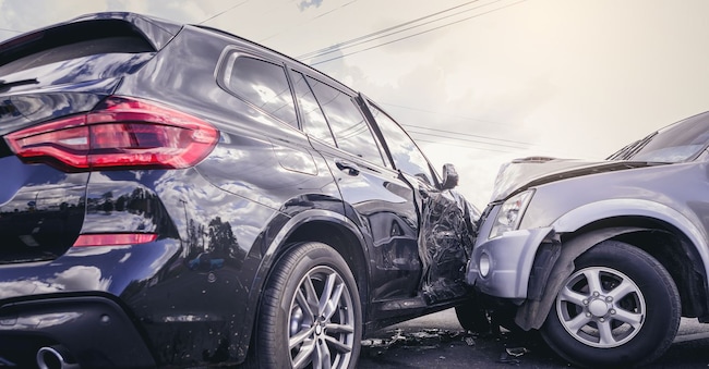 Car crash dangerous accident on the road. SUV car crashing beside another one on the road. Panumas - stock.adobe.com