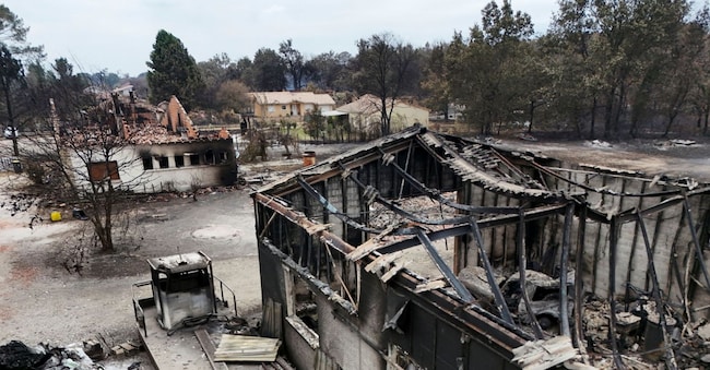 A drone view shows a burnt building in an area affected by wildfire, in Le Porge, Gironde, amongst worsening drought conditions following a heatwave and water shortages across much of France, July 26, 2026. REUTERS/Manon Cruz REUTERS