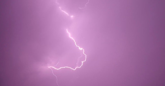 epa12324496 A stroke of lightning flashes across the sky during a thunderstorm over Sana EPA