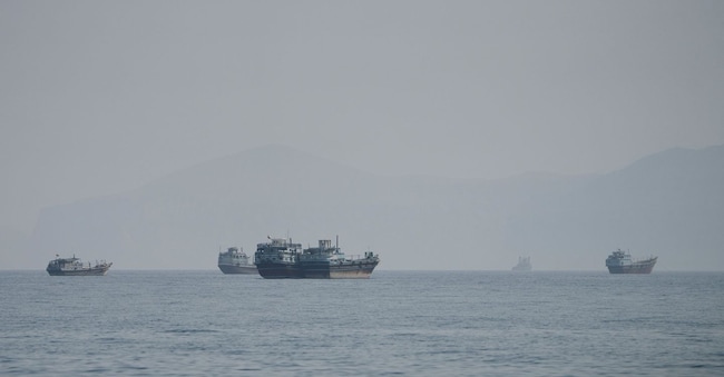 Vessels near the Strait of Hormuz, as seen from Musandam, Oman, August 24, 2026. REUTERS/Stringer REUTERS
