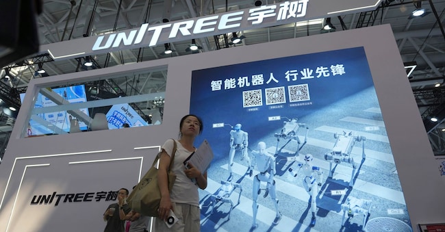 Lo stand di Unitree a Pechino, il 20 agosto 2026.  (AP Photo/Ng Han Guan)