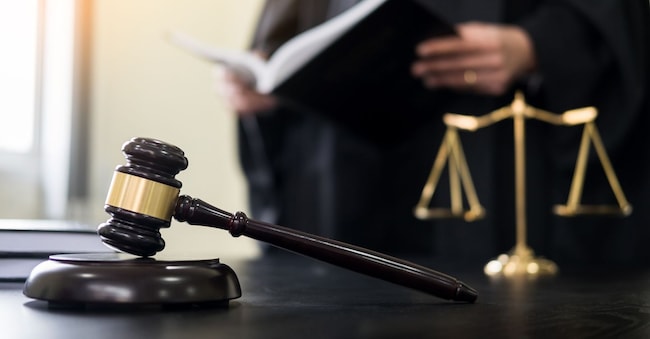 gavel and soundblock of justice law and lawyer working on wooden desk background snowing12 - stock.adobe.com