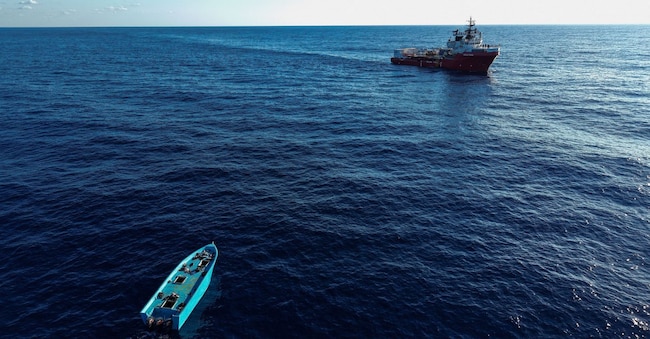 A drone view shows an empty migrant boat after its occupants were rescued by Italy's Guardia di Finanza, near the Ocean Viking in the central Mediterranean Sea, September 16, 2026. REUTERS/Stephane Mahe REUTERS
