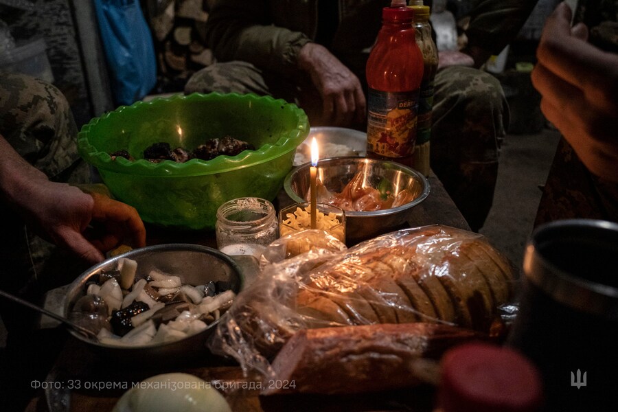 epa11792495 A handout picture made available by the 33rd Separate Mechanized Brigade press service shows servicemen of the 33rd Separate Mechanized Brigade preparing a festive dinner on Christmas Eve near a frontline in the Dnipropetrovsk region, Ukraine, 24 December 2024 amid ongoing Russian invasion. Ukraine celebrates Christmas on 25 December for the second time in accordance with the Western calendar. Ukrainian President Zelensky signed a law in July 2023 to move the official Christmas Day holiday to 25 December, departing from the Russian Orthodox Church tradition of celebrating on 07 January. Russian troops entered Ukraine on 24 February 2022 starting a conflict that has provoked destruction and a humanitarian crisis. EPA/Press service of the 33rd Separate Mechanized Brigade HANDOUT HANDOUT EDITORIAL USE ONLY/NO SALES (EPA)