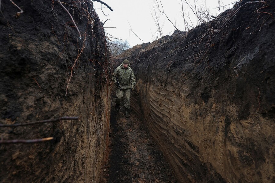 A Ukrainian serviceman walks in a trench which was built as part of a system of new fortifications, amid Russia's attack on Ukraine, in Kharkiv region, Ukraine December 22, 2024. REUTERS/Vyacheslav Madiyevskyy (REUTERS)