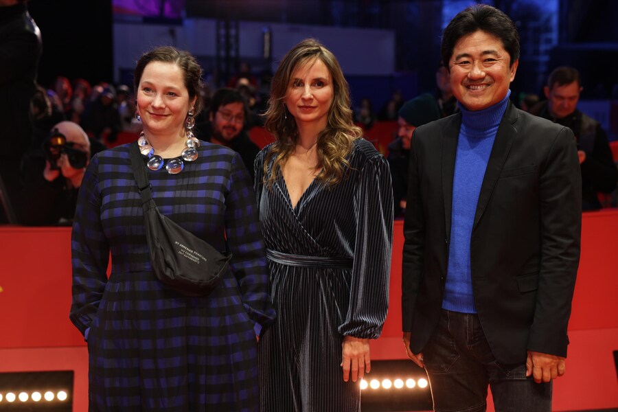 Kazuhiro Soda (R), Petra Costa, Lea Glob arrive for the closing ceremony of the 75th Berlin International Film Festival 'Berlinale', in Berlin, Germany, 22 February 2025. EPA/CHRISTOPHER NEUNDORF (EPA)
