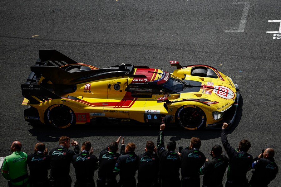 epaselect epa12177332 AF Corse car (starting no.?83) a Ferrari?499P with Robert Kubica of Poland, Yifei Ye of China and Phil Hanson of Great Britain crosses the finish line to win the 93rd edition of the 24 Hours of Le Mans race in Le Mans, France, 15 June 2025. EPA/YOAN VALAT (EPA)