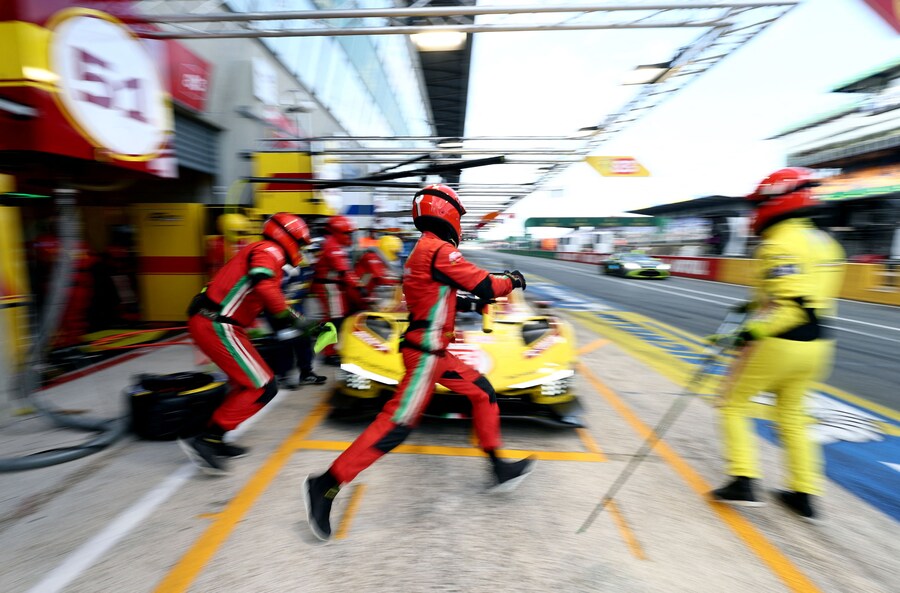 The 24 Hours of Le Mans - Circuit de la Sarthe, Le Mans, France - June 15, 2025 Pit crew work on the car of AF Corse's Robert Kubica, Yifei Ye and Philip Hanson during the 24 Hours of Le Mans REUTERS/Stephane Mahe (REUTERS)