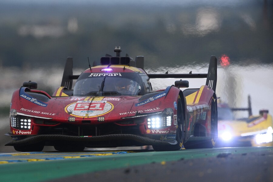 Ferrari AF Corse Thor Team's hypercar #51 British driver James Calado competes in front of Ferrari AF Corse Thor Team's hypercar #83 British driver Philip Hanson during the 2025 Le Mans 24 hour endurance race, at the Le Mans circuit, in northwestern France, on June 15, 2025. (Photo by JEAN-FRANCOIS MONIER / AFP) (AFP)