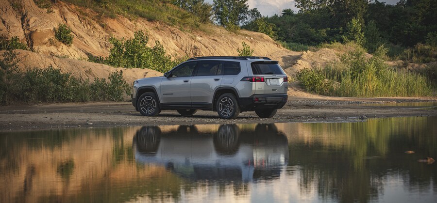 2026 Jeep® Cherokee Limited rear three-quarter view in front of reflecting water (© 2025 Stellantis)