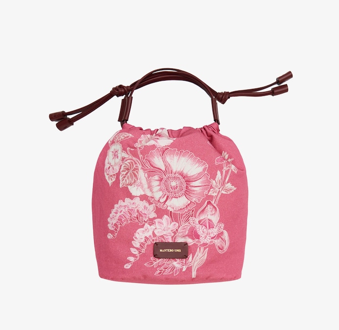 Borsa a secchiello in cotone e lino con stampa floreale grafica, MANTERO (230 €).