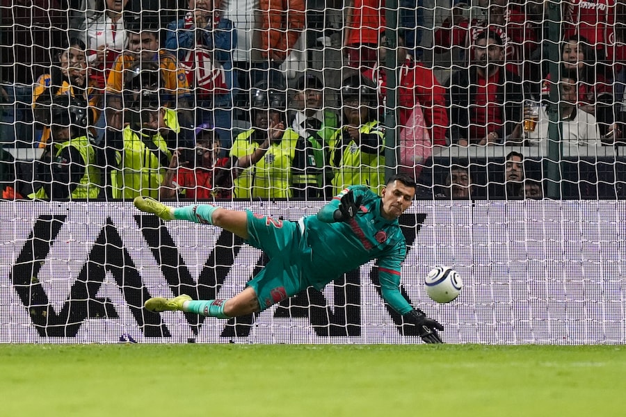 Toluca's goalkeeper Luis Garcia blocks a shot by Tigres' Fernando Gorriaran during a penalty shootout on the CONCACAF Champions Cup final soccer match in Toluca, Mexico, Saturday, May 30, 2026. (AP Photo/Fernando Llano) (AP Photo/Fernando Llano)