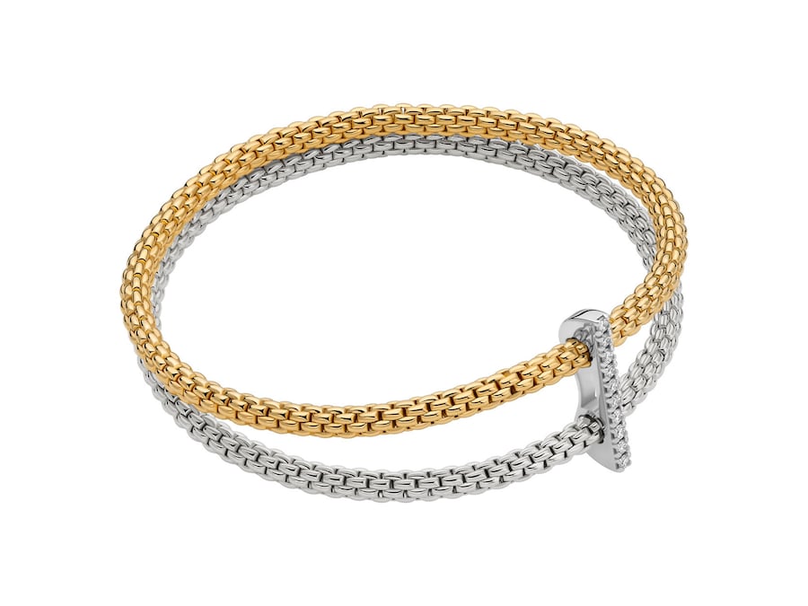 Fope. In oro giallo e bianco, il bracciale snodato Twins legato da una bacchetta in diamanti
