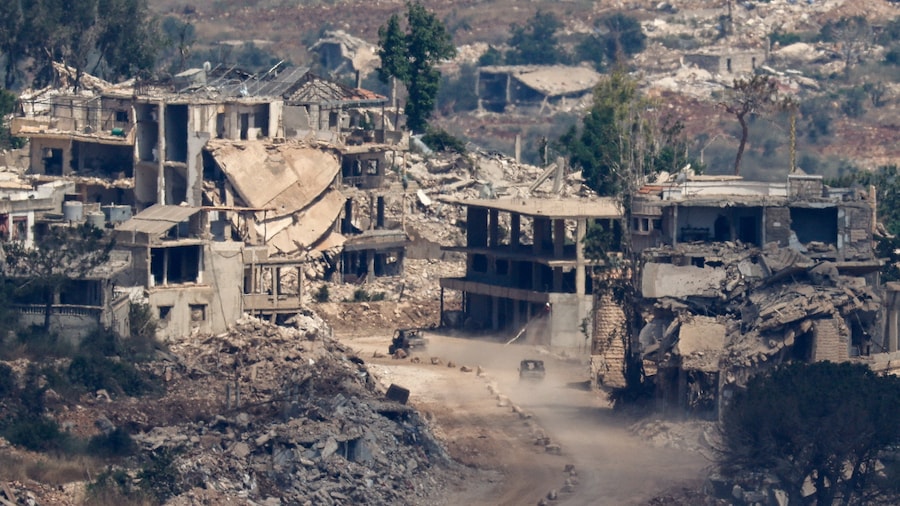 Israeli military vehicles drive amid destroyed buildings in Lebanon, after Israel and Lebanon signed a framework agreement following U.S.-mediated talks, as seen from northern Israel, June 27, 2026. REUTERS/Amir Cohen (REUTERS)