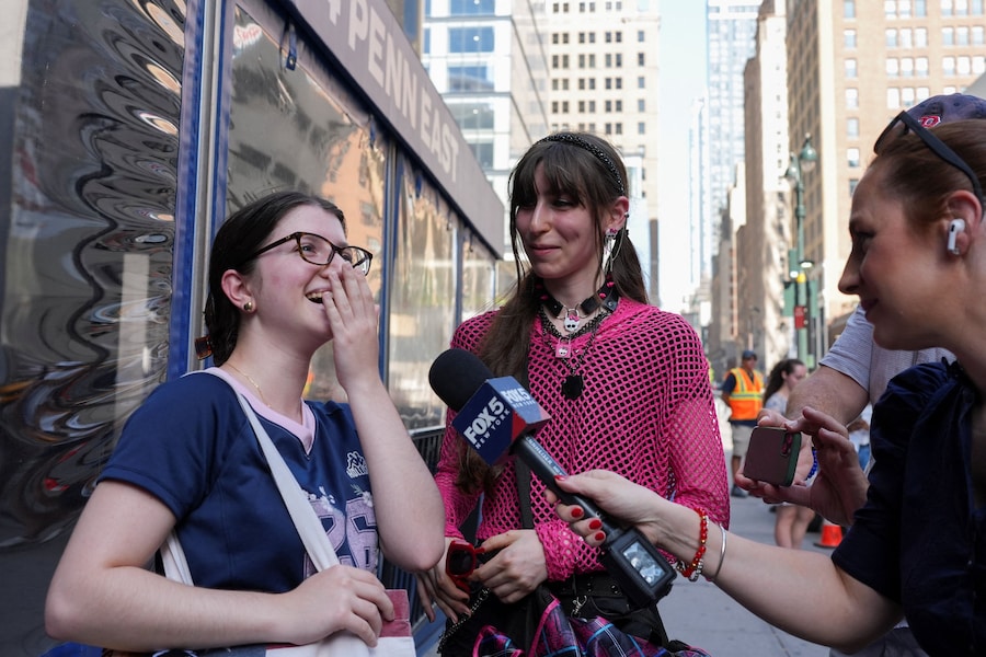 A girl talks to the press outside Madison Square Garden, ahead of a reported wedding between singer Taylor Swift and National Football League (NFL) player Travis Kelce, in New York City, U.S., July 2, 2026. REUTERS/Christian Monterrosa (REUTERS)