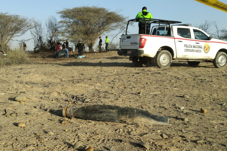 epa13146563 Members of the Peruvian National Police are on the scene where a small plane flying over the Nazca Lines crashed, killing at least 13 people, including 11 tourists, in the provincial municipality of Nazca, Peru, 01 August 2026. EPA/Victor Quilca BEST QUALITY AVAILABLE (EPA)