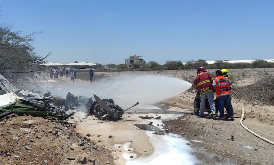 epaselect epa09728578 Firefighters extinguish the fire at the wreckage of the plane that crashed today in the Ica region, Peru, 04 February 2022. At least seven people, including several tourists, died this 04 February after the plane they were traveling in crashed when trying to land after touring the famous Nazca lines, in the Ica region, in southern Peru, local media reported. EPA/Henry Linares (EPA)