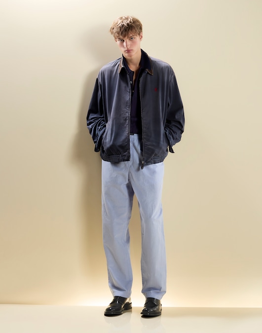 Prada. Giubbotto in cotone con dettagli in pelle, polo in cashmere e seta, pantaloni in cotone