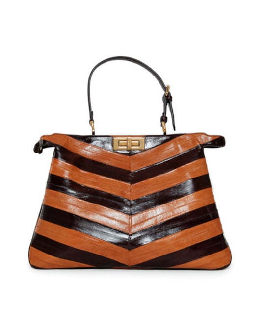 AN ORANGE & BLACK CHEVRON STRIPED FENDI PEEKABOO BAG SCREEN WORN BY MERYL STREEP FENDI Estimate: $ 3,000 -4,000 Courtesy: CHRISTIE’S IMAGES LTD. 2026