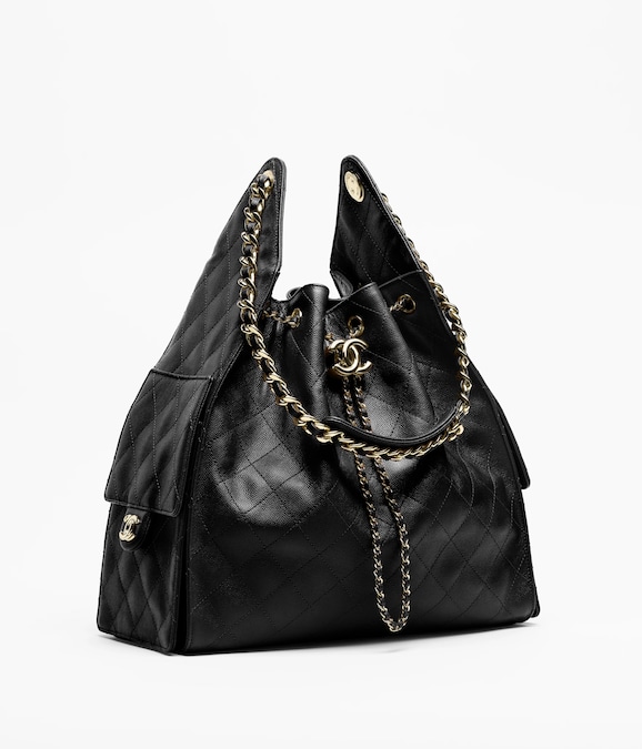 Chanel. Modello 25, in pelle martellata matelas-sé, con tasche laterali e catena dorata
