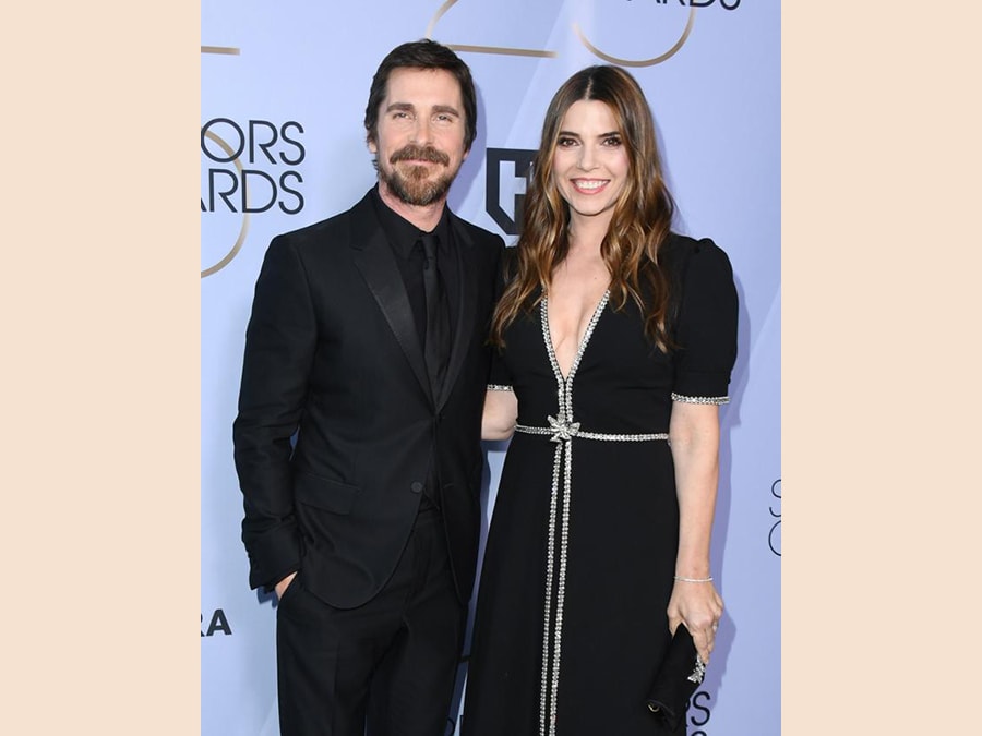 Christian Bale e Sibi Blazic, entrambi in Gucci