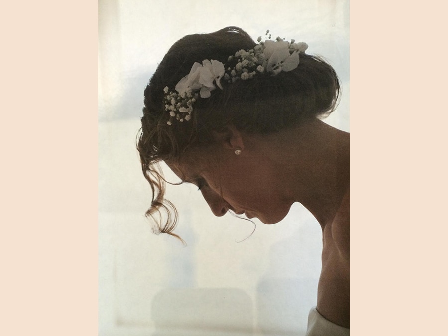 Mastromauro Hairstylist, chignon cotonato con fiori