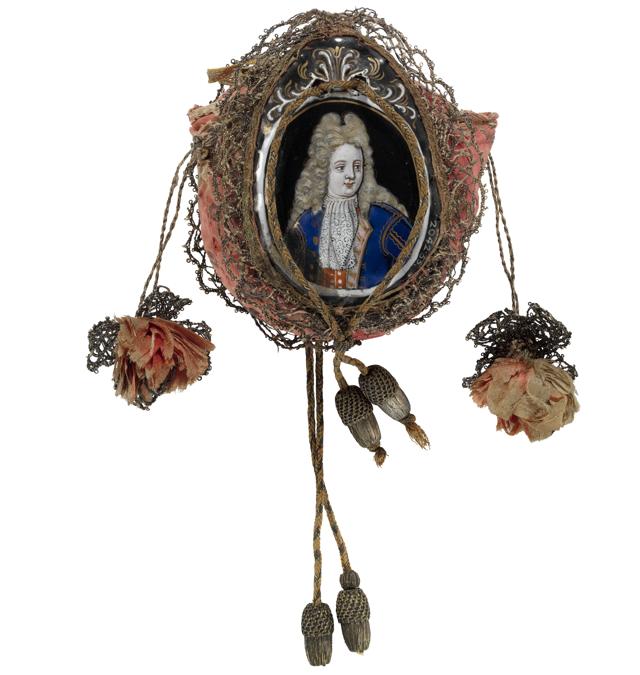 Limoges marriage purse of pink silk brocade, edged with silver lace and enamelled miniatures of a betrothed couple attached to either side. 1700-1750. France