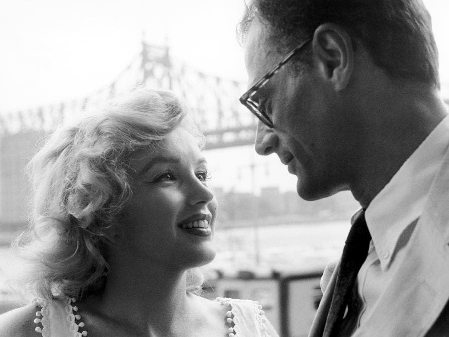 Marilyn Monroe and her husband Arthur Miller in front of the Queensboro Bridge, New York City, 1957 (Photo by Sam Shaw ©Shaw Family Archives, Ltd)