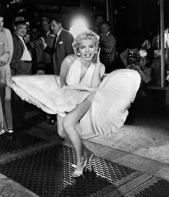 Sam Spade and Marilyn Monroe during the filming of The Seven Year Itch, 51st Street and Lexington Avenue, New York City, 1954  (Photo by Sam Shaw ©Shaw Family Archives, Ltd)