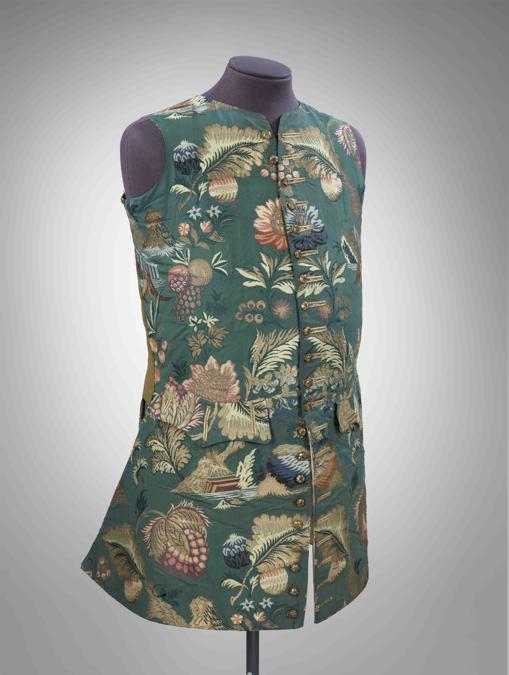 Waistcoat, 1730-35; of brocaded silk, French, naturalistic design on dark green ground. © Victoria and Albert Museum, London