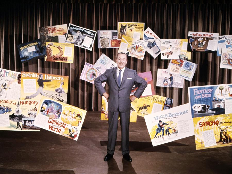 Walt Disney (1901 - 1966) con locandine di alcuni suoi film. (Photo by Silver Screen Collection/Getty Images)