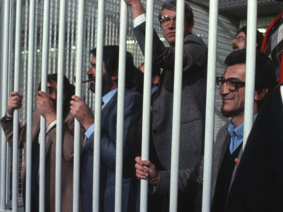 Toni Negri, Paolo Pozzi e Francesco Tommei in aula durante il processo del 7 aprile 1983 a Roma. ANSA/OLDPIX