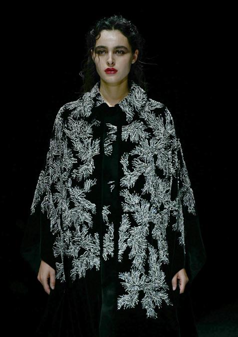 A model walks the runway at the Emporio Armani collection show during the Milan Fashion Week Menswear Autumn/Winter 2024/2025 on January 13, 2024 in Milan. (Photo by GABRIEL BOUYS / AFP)