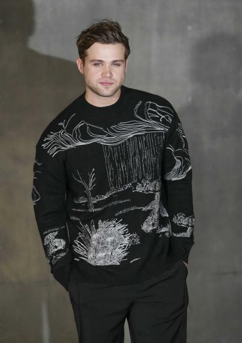 Leo Woodall attends the men's Giorgio Armani Fall-Winter 2024-2025 collection, that was presented in Milan, Italy, Saturday, Jan. 13, 2024. (AP Photo/Luca Bruno).