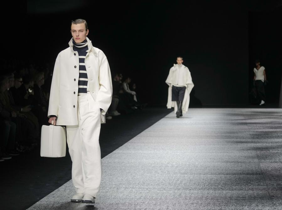A model wears a creation as part of the men's Giorgio Armani Fall-Winter 2024-2025 collection, that was presented in Milan, Italy, Saturday, Jan. 13, 2024. (AP Photo/Luca Bruno).