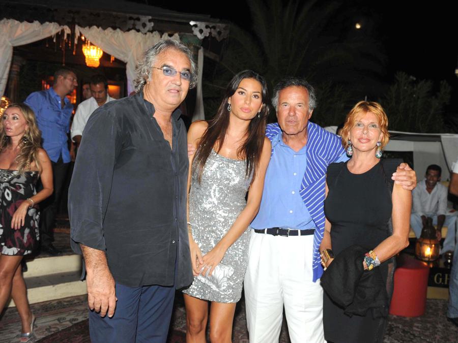 2009,  Sardegna, Porto Cervo, discoteca Billionaire - festa per il 43° anniversario delle nozze di Ennio Doris e della moglie Lina. Flavio Briatore, Elisabetta Gregoraci  con Giuliano Adreani  e moglie CIC (Foto di IPA/Sipa USA)