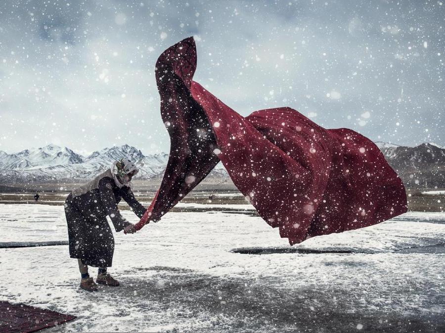 Image Name: Working in the wind and snow. Photographer Name: Zhou Jianguang. Year: 2018. Copyright: © Jianguang Zhou, China Mainland, Shortlist, Open Enhanced, and 3rd Place, China National Award, 2018 Sony World Photography Award