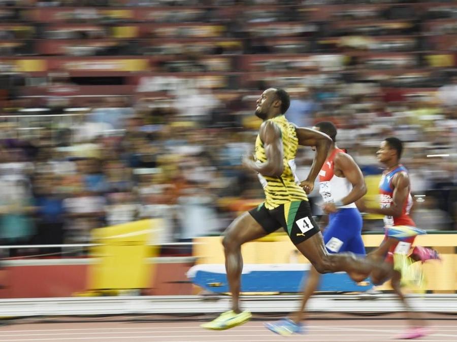 2015. Decimo oro mondiale in carriera, vincendo la finale dei 200 metri ai mondiali di Pechino. (AFP)