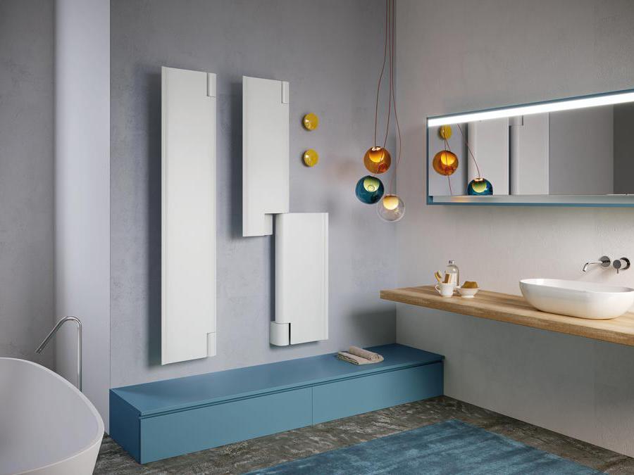 Intrax, Byobu, design Marc Sadler. Termoarredo che nel nome, nelle linee e nel movimento trae ispirazione dal tipico paravento decorativo giapponese. Realizzato in alluminio riciclabile, il corpo riscaldante è costituito da due componenti sottili, dalla forma squadrata, pulita e lineare che si muovono ruotando attorno a un perno centrale, assumendo forme diverse. I due pannelli riscaldanti possono essere posizionati entrambi a destra, entrambi a sinistra, creando un unico grande pannello oppure in modo opposto. Byobu, quando collocato nello spazio bagno o wellness, può essere utilizzato come scaldasalviette. Byobu è idotato di un accessorio complementare, il “momoko”, che in giapponese significa piccola pesca, ovvero un gancio da fissare alla parete, singolo o in serie, per appendere salviette o accappatoi. Proposto sia con funzionamento ad acqua sia elettrico e nella dimensione di 170x38cm, Byobu è inoltre disponibile nella versione con un unico grande pannello riscaldante