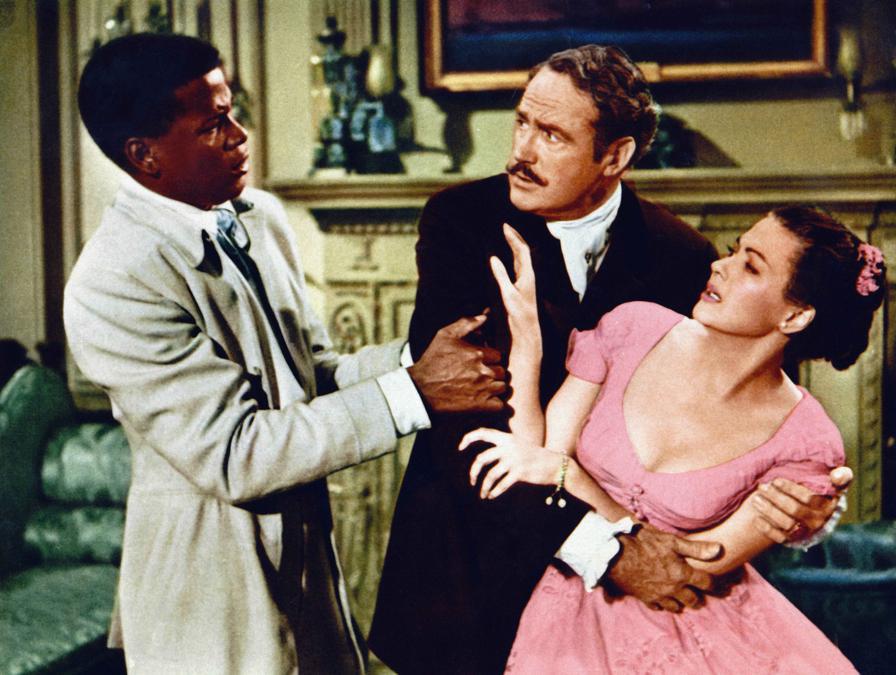 Una scena dal film “La  banda degli angeli” (1957). Nella foto, Sidney Poitier, Patric Knowles, Yvonne De Carlo. (foto IPP/imagostock)