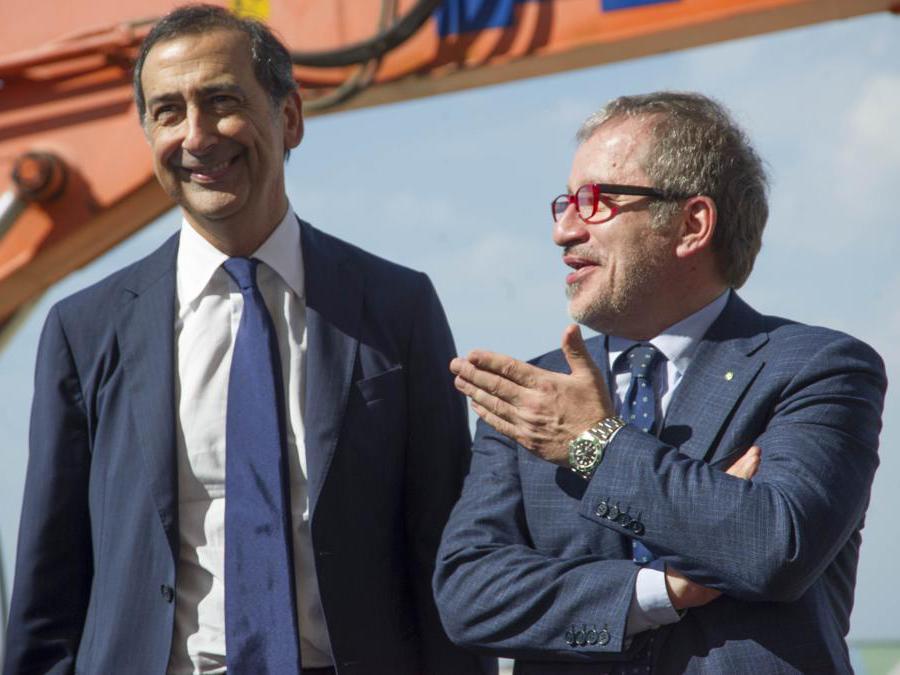Milano, 16/7/2014. Expo 2015. Visita e avvio dei lavori del padiglione degli Stati Uniti d'America. Nella foto, Roberto Maroni, presidente Regione Lombardia e Giuseppe Sala, commissario unico Expo 2015. (Foto Italy Photo Press / Mario Romano)